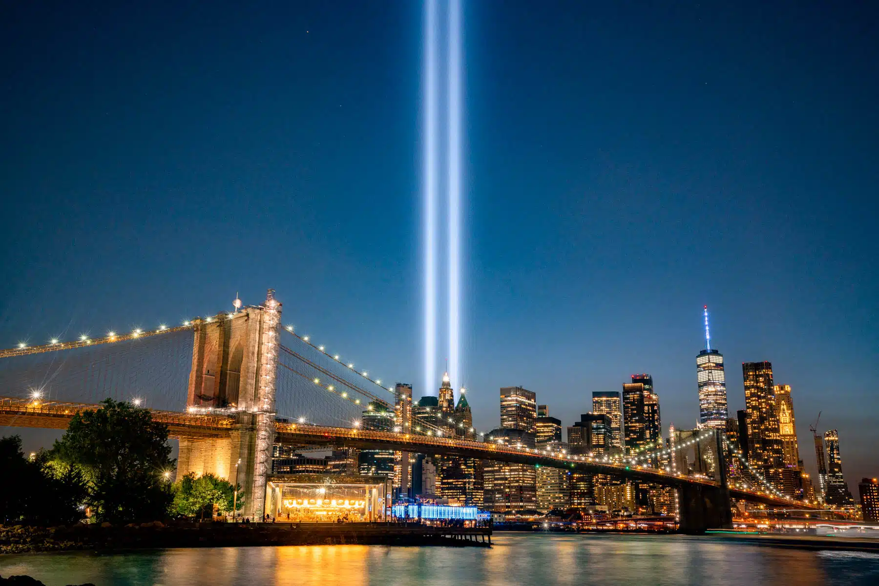 view of 9/11 Lights from DUMBO, crossing the Brooklyn Bridge at Night