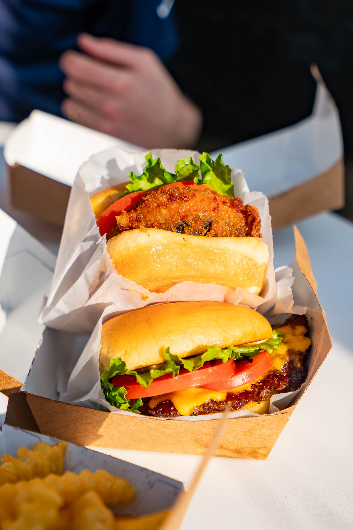 Chicken burger and cheeseburger from Shake Shack in NYC, things to do