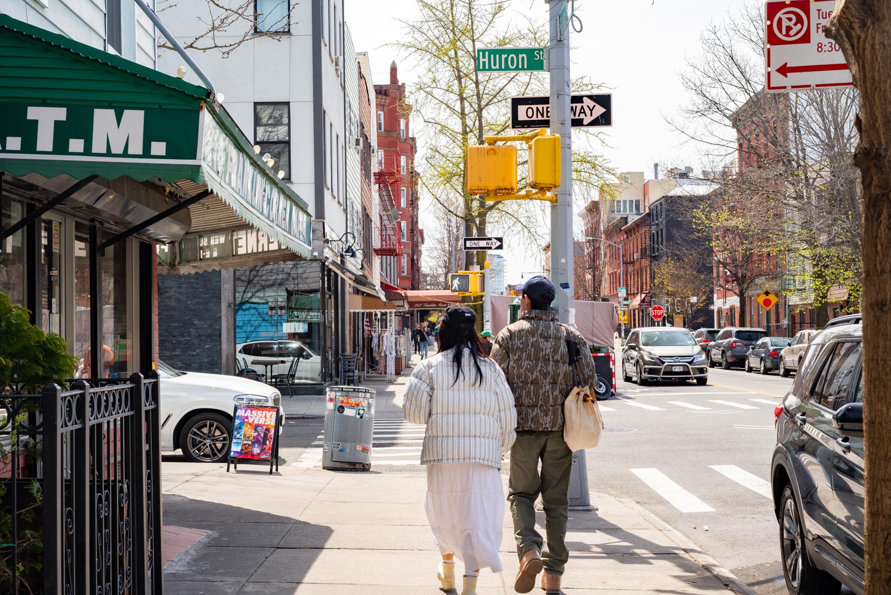 Fashionable couple walking down a Greenpoint street during the spring, Best neighborhoods Brooklyn