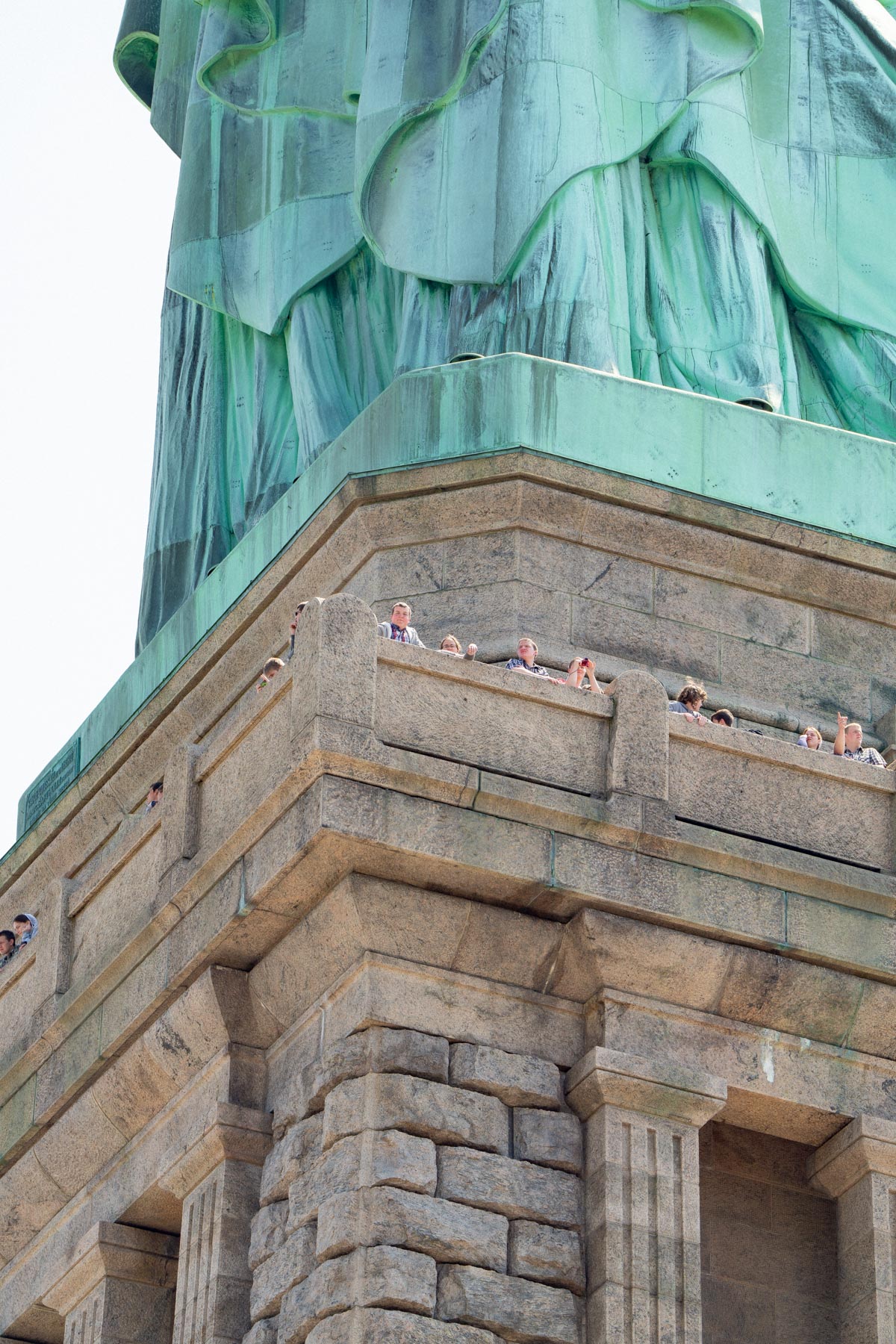people at the pedestal level of the Statue of Liberty