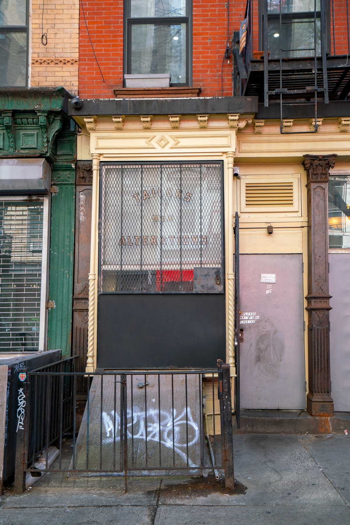 Exterior of Attaboy, which has no signage except for an AB on the door