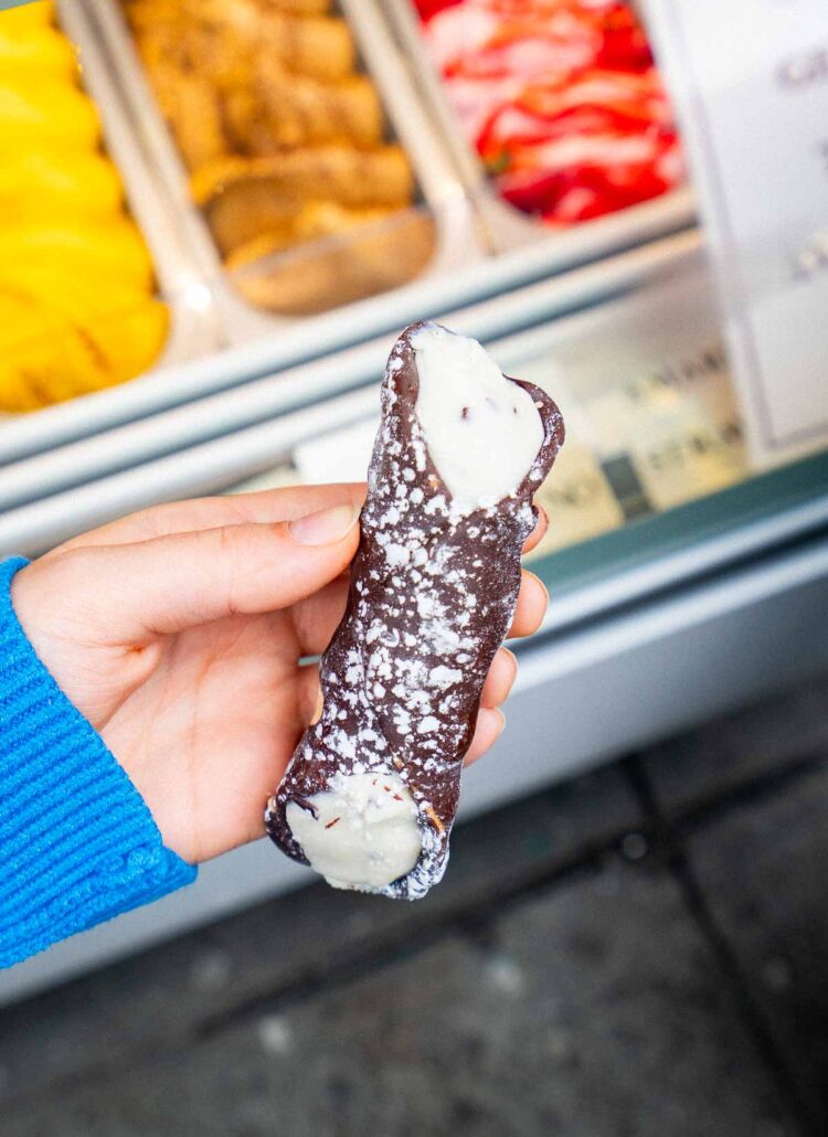Chocolate dipped cannoli with cream from Ferrara Bakery in Little Italy NYC