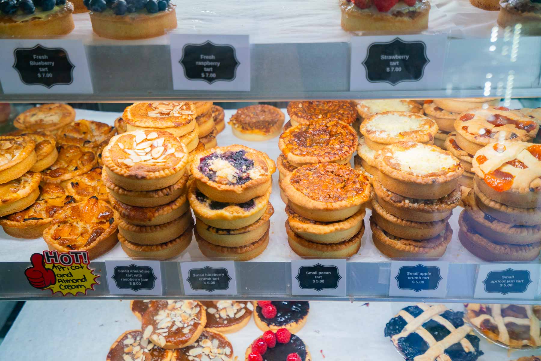 Multiple tart flavors on display at Le French Tart Deli 