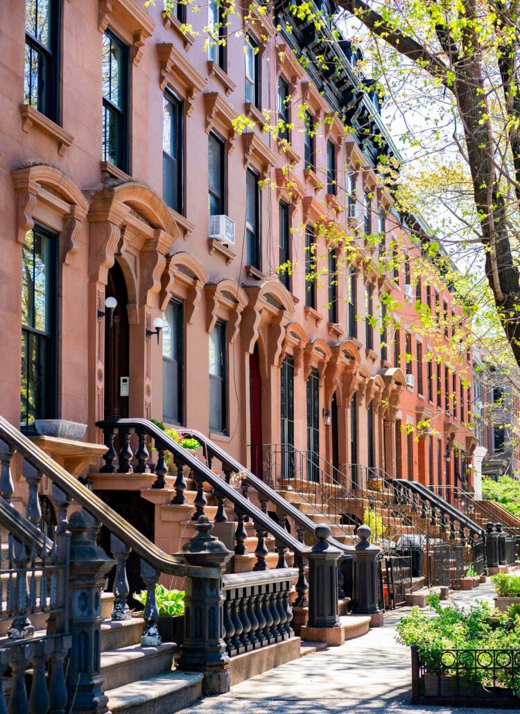 Brownstone rowhouses in a variety of browns and oranges in Fort Greene, one of the best neighborhoods to live in Brooklyn